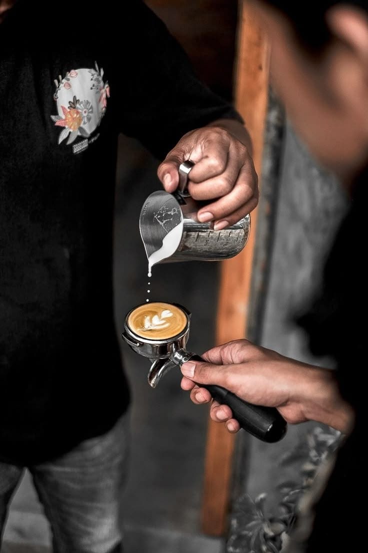 Barista crafting latte art