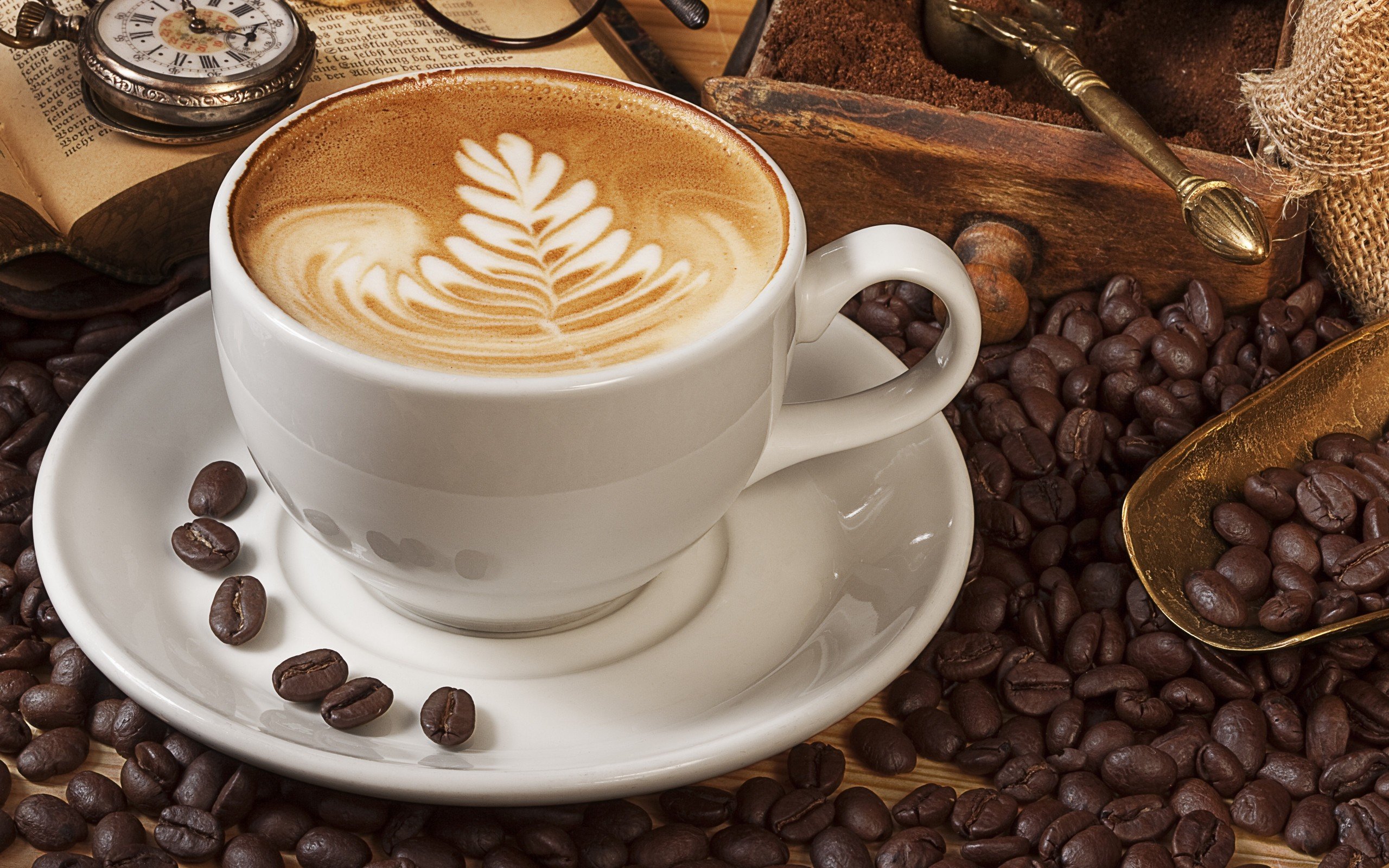 A beautiful latte art cup with a heart design on top